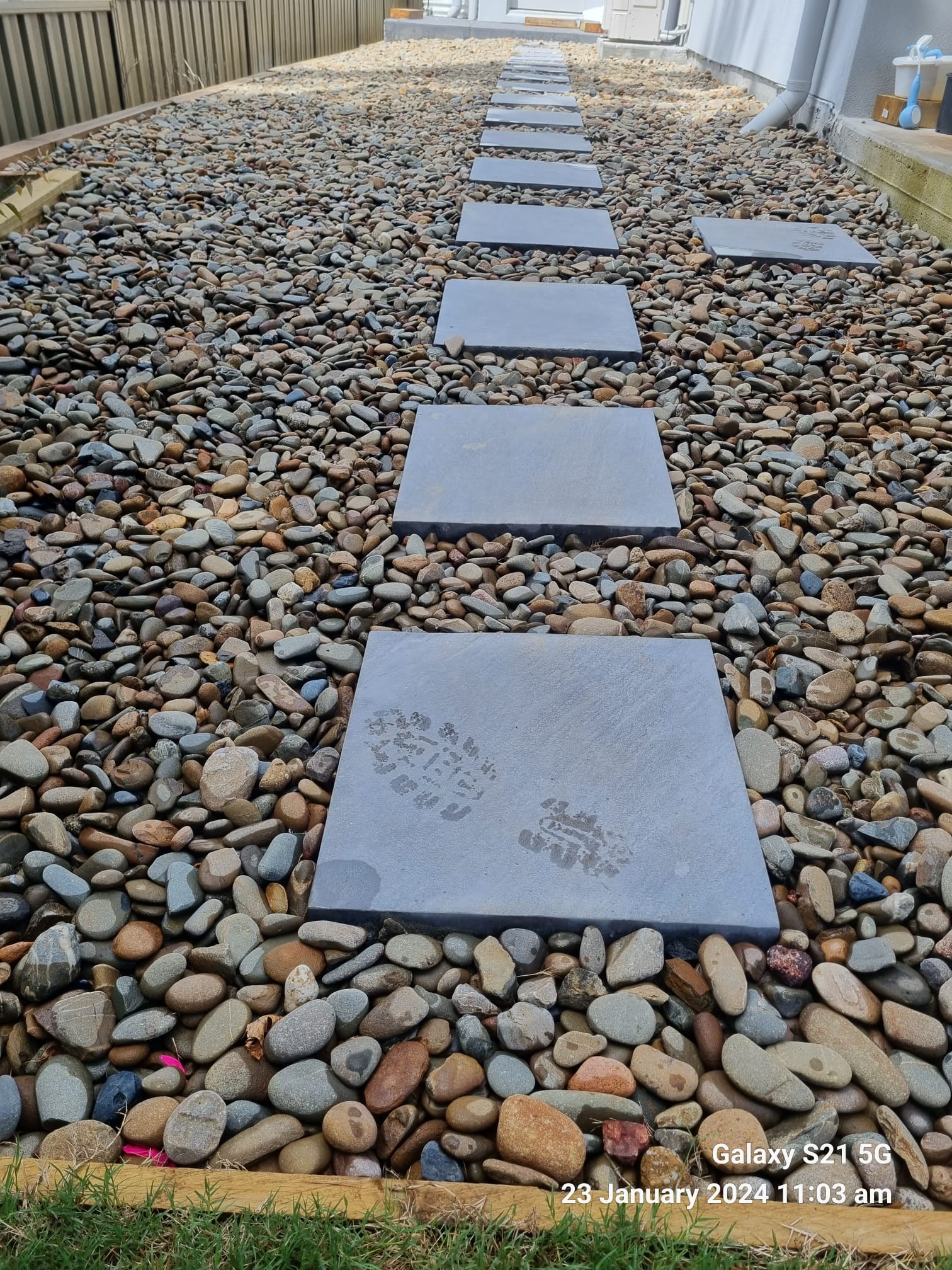 Landscaped driveway and retaining wall completed by Active Landscapes
