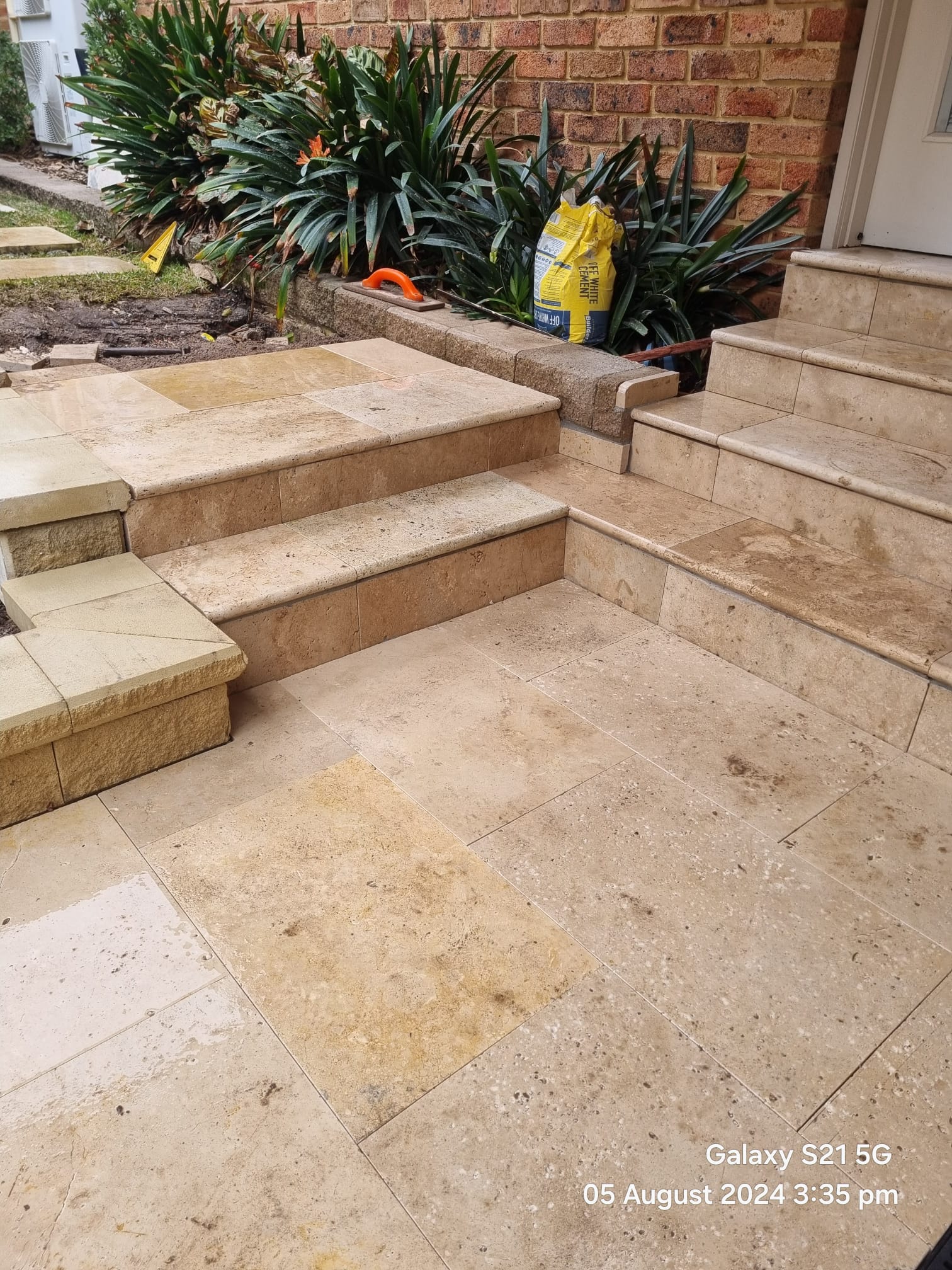 Landscaped driveway and retaining wall completed by Active Landscapes