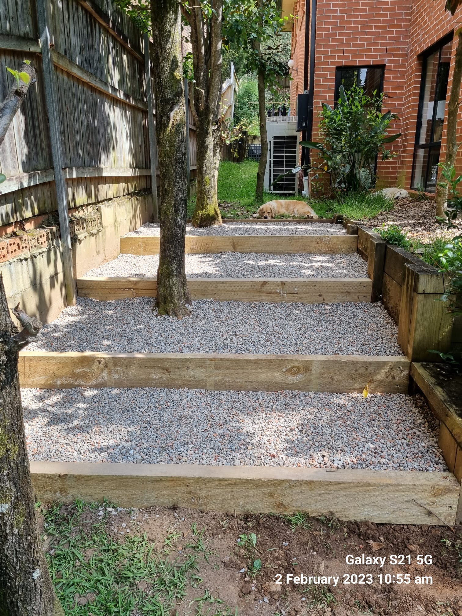 Landscaped driveway and retaining wall completed by Active Landscapes