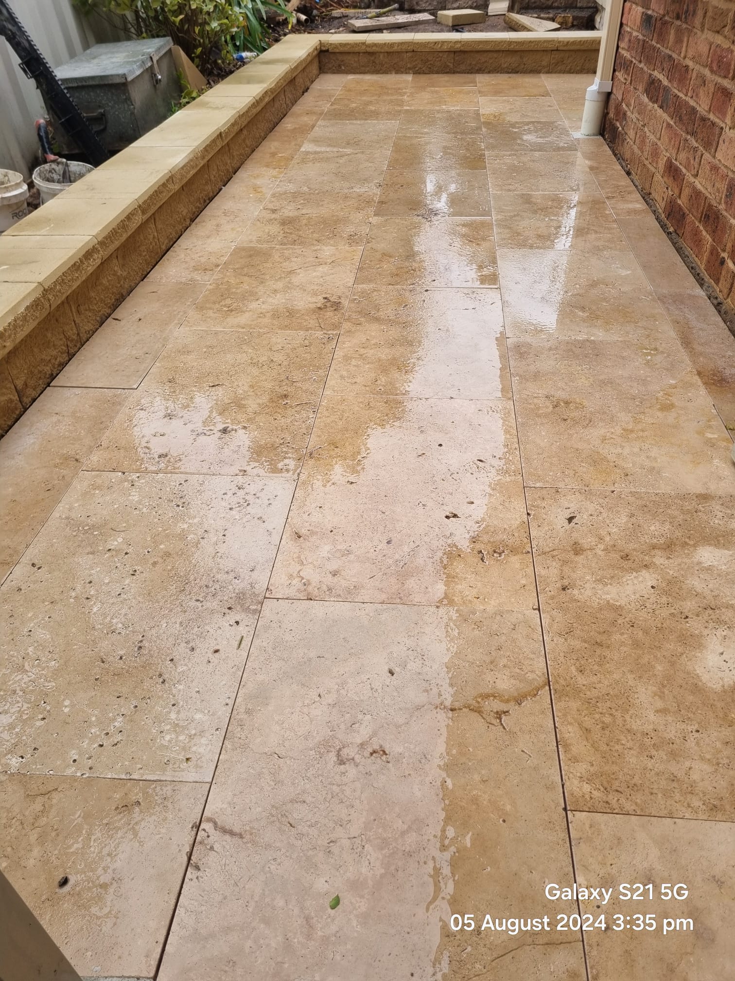 Landscaped driveway and retaining wall completed by Active Landscapes