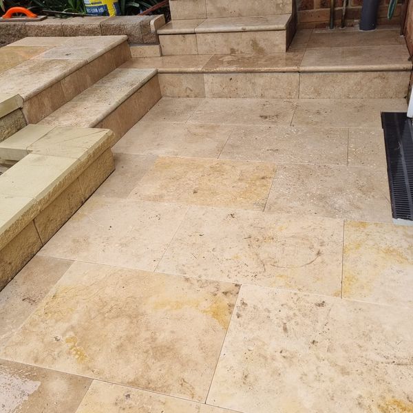 Travertine paved patio and outdoor steps